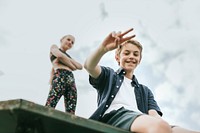 Aesthetic background, kid/kids sitting on a roof, enjoying summertime