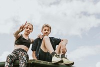 Aesthetic background, kids sitting on a roof, family photo