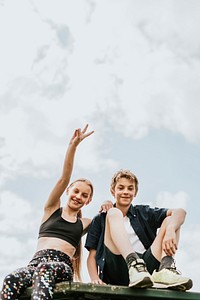 Aesthetic background, kids sitting on a roof, family photo