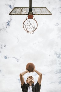 Sport background, young boy playing basketball, summer hobby