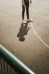 Sport background, girl with a jump rope, summer hobby