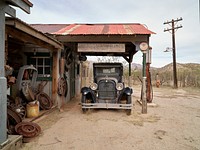 Vintage car and garage at Gammons Gulch, a recreated Old West town and the site of dozens of movies, commerical shoots and the like in the remote desert north of Benson in Cochise County, Arizona.
