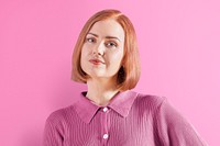 Happy ginger-haired woman in pink knitted shirt