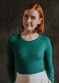 Cheerful woman in green long sleeve, autumn apparel fashion design