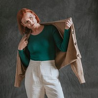 Woman in green long sleeve, wearing beige cardigan, autumn apparel fashion design