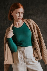 Woman in green long sleeve and beige cardigan