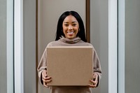 Happy woman receiving delivery package to her front door