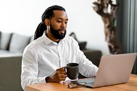 African American man working on laptop