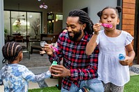 Kids playing in garden during summer