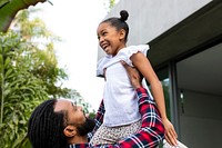 Father and daughter playing in garden