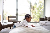 Boy playing on phone alone at home