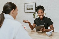 Esthetician giving advice to customer