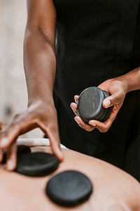 Stone massage in spa salon photo