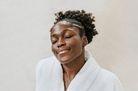 African American woman in bathrobe 