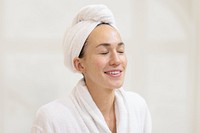 Woman in bathrobe with towel on head