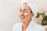 Woman in bathrobe with towel on head