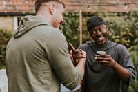 Happy friends talking to one another at a party 