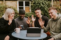 Friends having a video call with friends who could not attend the party 