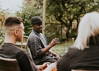 Friends sitting down together at a a party 