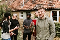 Happy friends toasting to celebrate at a Christmas party