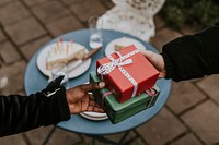 Friends exchanging gifts at a Christmas party 