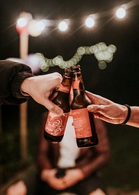 Hands toasting to celebrate at a Christmas party