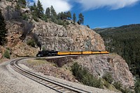 A Durango &amp; Silverton Narrow-Guage Scenic Railroad train, pulled by a vintage steam locomotive, rounds a high San Juan Mountains precipe in Las Animas County, Colorado. Original image from <a href="https://www.rawpixel.com/search/carol%20m.%20highsmith?sort=curated&amp;page=1">Carol M. Highsmith</a>&rsquo;s America, Library of Congress collection. Digitally enhanced by rawpixel.