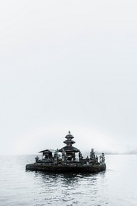 Hindu temple in the mist on a lake in Bali