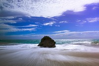 Big rock in the middle of the shore