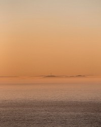 Foggy and faint ocean horizon at sunset