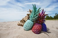 Colorful pineapple on a beach