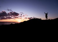 Man standing on top of a hill