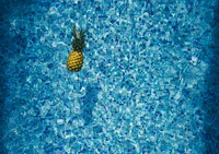 Tropical pineapple in a swimming pool