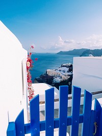 Scenic of Oia traditional white painted house with Aegean sea view in Santorini, Greece