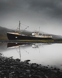 Abandoned ship by a black sand beach in Iceland
