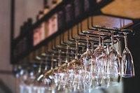 Wine glasses hanging in a bar. Visit <a href="https://kaboompics.com/" target="_blank">Kaboompics</a> for more free images.