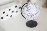 White globe on a table. Visit <a href="https://kaboompics.com/" target="_blank">Kaboompics</a> for more free images.