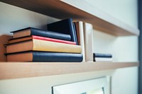 Books on a shelf. Visit <a href="https://kaboompics.com/" target="_blank">Kaboompics</a> for more free images.