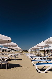 Lined up beach chairs. Visit Kaboompics for more free images.