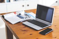 Laptop on a table. Visit <a href="https://kaboompics.com/" target="_blank">Kaboompics</a> for more free images.