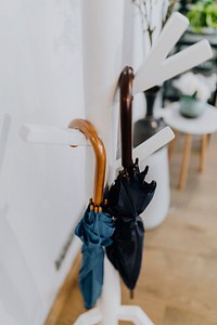 Umbrellas hanging on a stand. Visit <a href="https://kaboompics.com/" target="_blank">Kaboompics</a> for more free images.