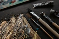 Brushes on a black table. Visit <a href="https://kaboompics.com/" target="_blank">Kaboompics</a> for more free images.