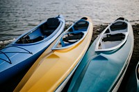 Colorful canoes in a lake. Visit <a href="https://kaboompics.com/" target="_blank">Kaboompics</a> for more free images.