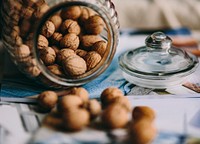 A jar full of walnuts. Visit <a href="https://kaboompics.com/" target="_blank">Kaboompics</a> for more free images.