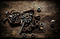 Rusty screws and bolts on a table. Visit <a href="https://kaboompics.com/" target="_blank">Kaboompics</a> for more free images.