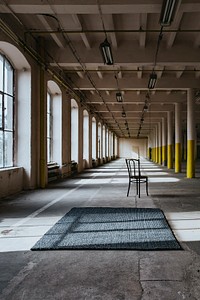 Industrial studio with a chair. Visit Kaboompics for more free images.