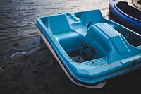 Blue paddle boat in a lake. Visit <a href="https://kaboompics.com/" target="_blank">Kaboompics</a> for more free images.