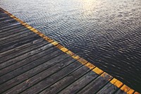 Wooden jetty by the water. Visit <a href="https://kaboompics.com/" target="_blank">Kaboompics</a> for more free images.