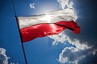 The Polish flag flying in the wind. Visit <a href="https://kaboompics.com/" target="_blank">Kaboompics</a> for more free images.