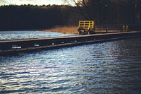 Old wooden pier by a lake. Visit <a href="https://kaboompics.com/" target="_blank">Kaboompics</a> for more free images.
